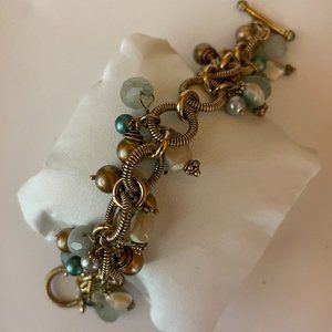 Gold Tone Charm Bracelet- makes a statement